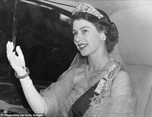 Princess Elizabeth demonstrating the royal wave in 1951. Pictured, she arrives at the Norwegian Embassy for a dinner hosted by King Haakon VII of Norway