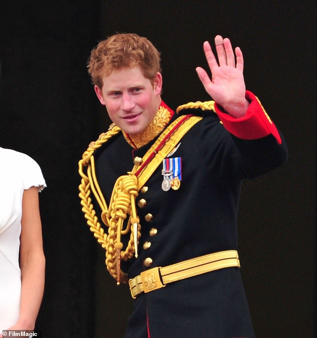 Prince Harry greets a crowd of admirers from the balcony of Buckingham Palace in 2011 after his brother William's wedding to Catherine