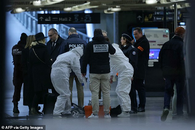 French forensic and judicial police visit the crime scene after a knife attack at Gare de Lyon train station in Paris