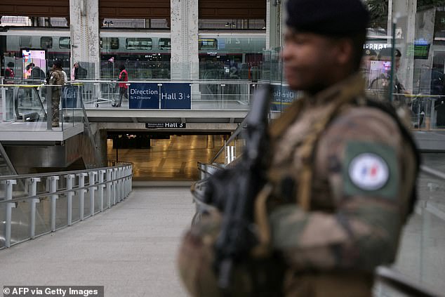 A French soldier from the Sentinelle security operation stands guard at the Gare de Lyon train station in Paris, which was immediately evacuated after the attack