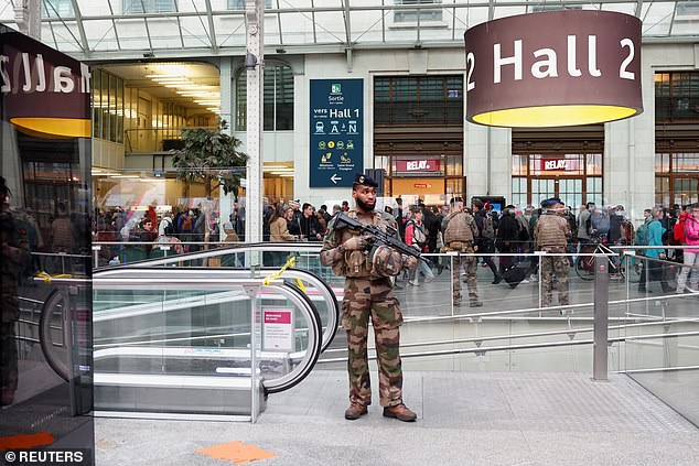 French soldiers secure the area after a man with a knife injured several people at the Gare de Lyon train station in Paris