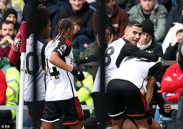 Muniz (right) appeared overcome with emotion as he was congratulated by his teammates