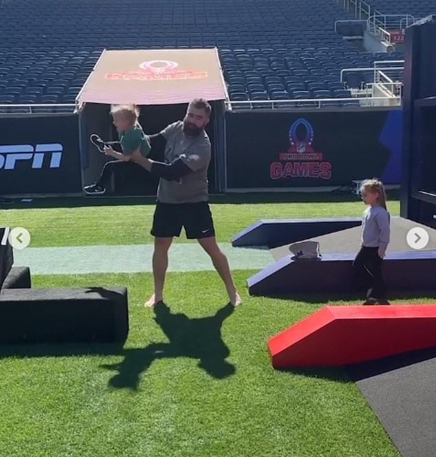 Kelce was seen waving his daughter through the air on the field in an adorable clip