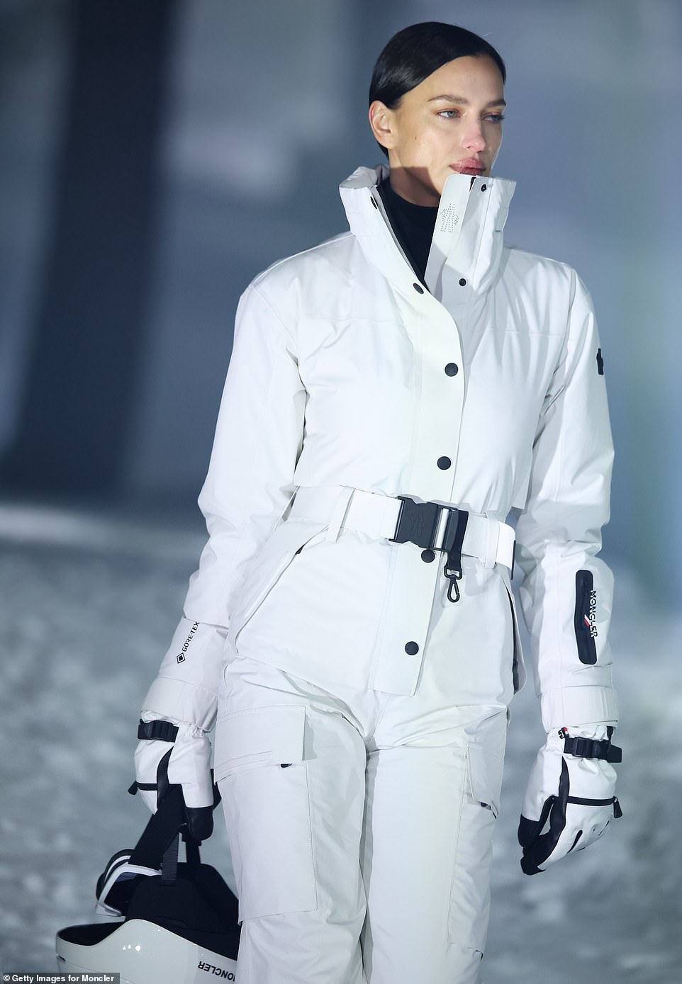 Irina - whose romance with Tom Brady continues to grow - looked ready for a slalom descent in her chic all-white ski suit
