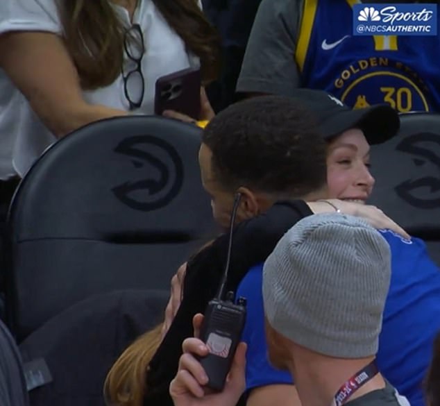 Curry shared a hug with Lohan, who attended the game in Atlanta with her husband on Saturday