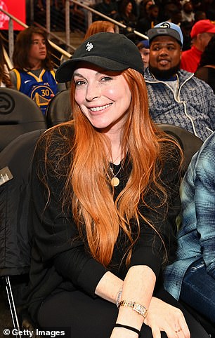 Lohan sat courtside and watched the match from the front row of the audience