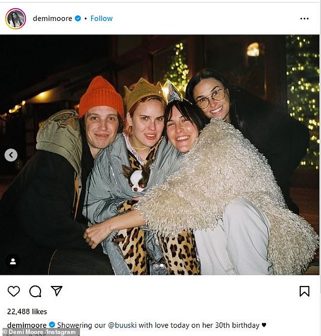 The proud mom captured Tallulah's birthday with a photo taken later that evening of her cuddling with her daughter, her boyfriend Justin Acee and her sister Scout
