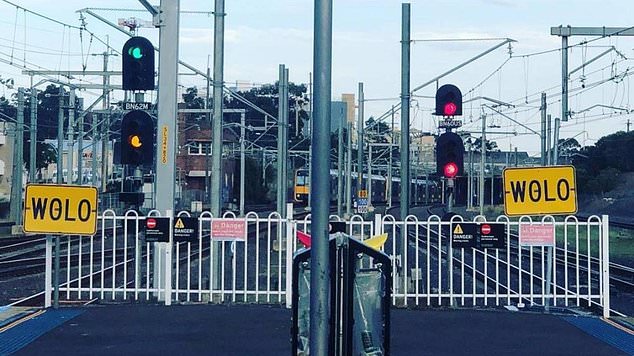 The reason for the signs is to indicate to drivers to drive more slowly, as steel tracks have the potential to expand in the heat