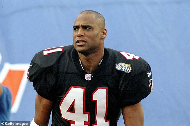 The Falcons' Eugene Robinson stands on the sidelines and watches during Super Bowl XXXIII