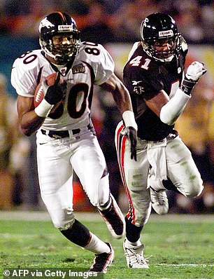 Robinson (right) yielded an 80-yard touchdown to receiver Rod Smith (left), later missing a tackle that allowed running back Terrell Davis to make a long run