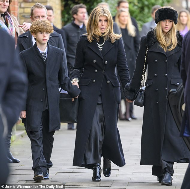 Kate and her children – Darcey, 17, and William, 14 – leave Derek's funeral at St Mary's Church in Primrose Hill on Friday