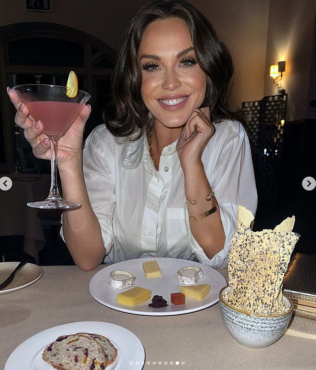 In another stunning photo, Vicky was seen enjoying a cheese tasting as she held a drink and beamed into the lens, wearing a white shirt and a glamorous make-up look for the night out