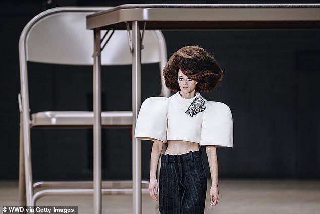 Another model wears a cropped white top with exaggerated sleeves and a black skirt