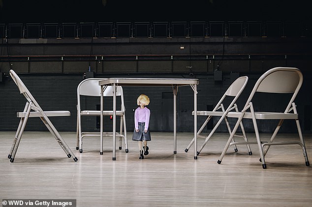 The miniature models contrast with the elephant furniture