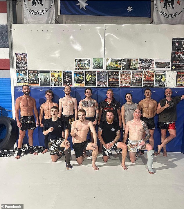 Nathan Jones (pictured front right), a champion Muay Thai fighter, said Mr Kirk (second from right, back row) had recently developed a passion for the martial art and traveled to Thailand to hone his skills