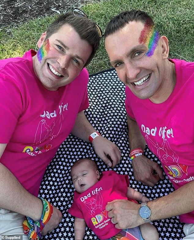 Mr MacRae (pictured with his partner Rob and daughter) said that although he was physically able to carry Bella without needing a chair, he was 'shocked' that no one offered to carry him