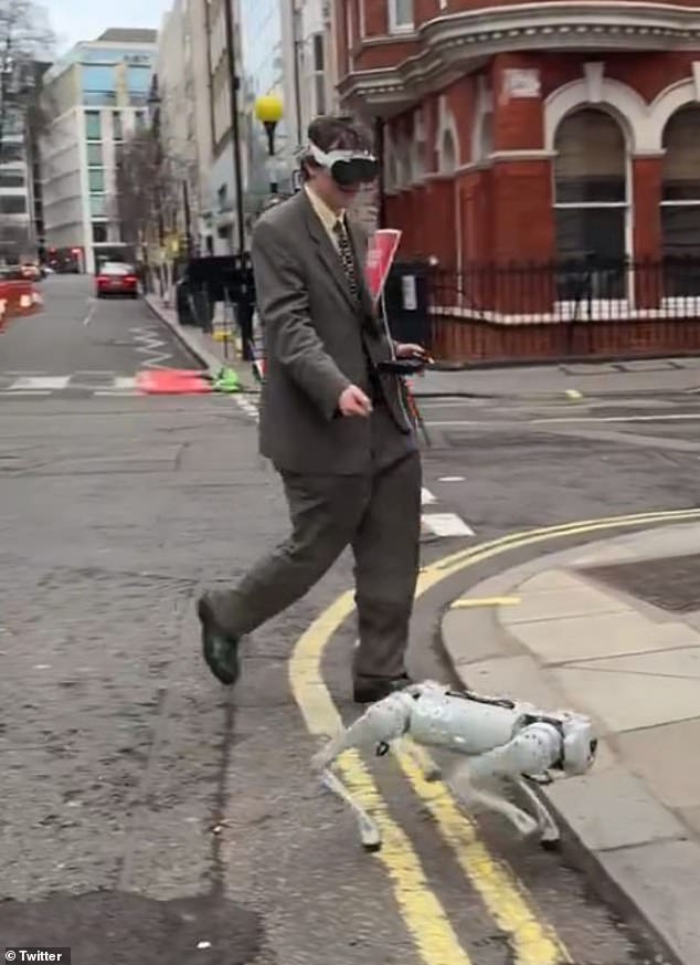 In London, video shows a man in a suit wearing the headset and walking down the street with his robot dog