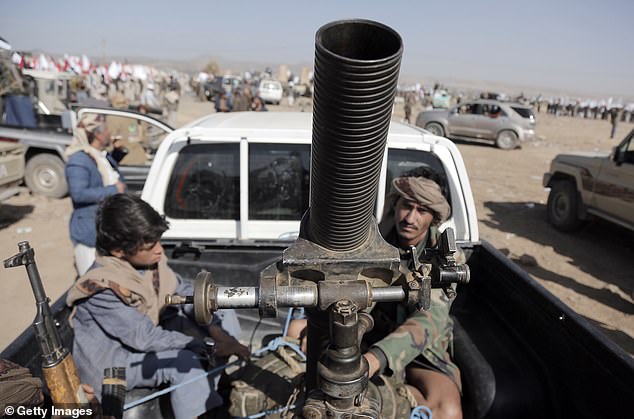 Houthi fighters are pictured riding in vehicles during a rally in support of Palestinians in the Gaza Strip, and the recent Houthi attacks on shipping in the Red Sea and Gulf of Aden on February 4