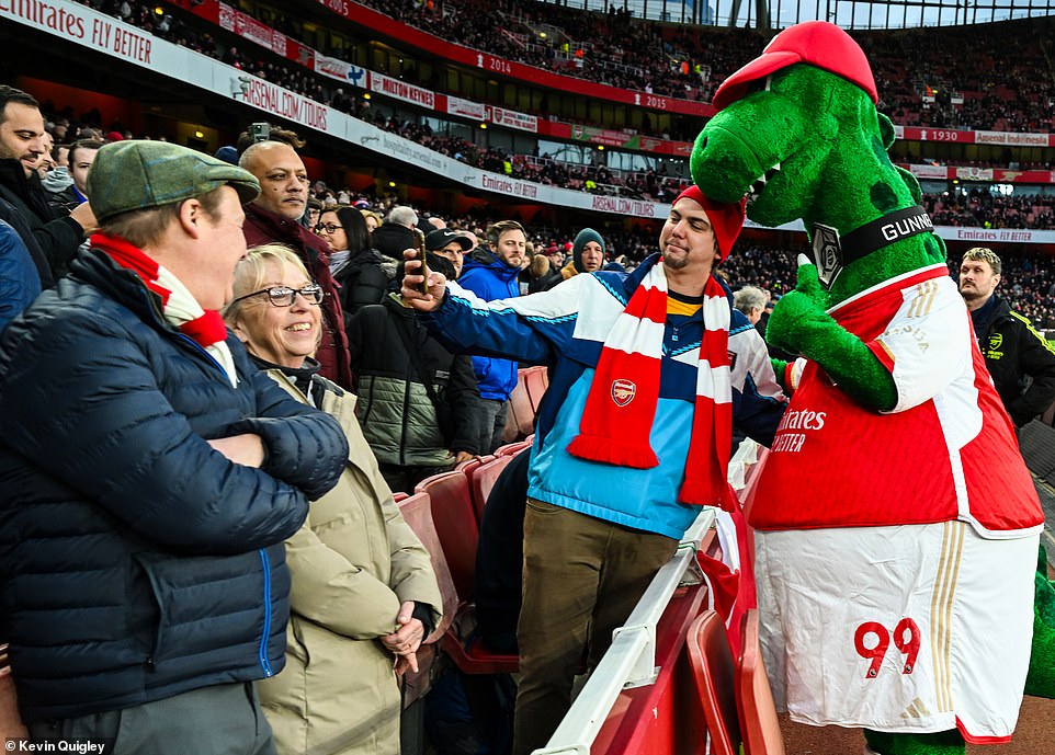 Arsenal's big mascot Gunnersaurus posed for photos with supporters as he tried to make noise ahead of kick-off