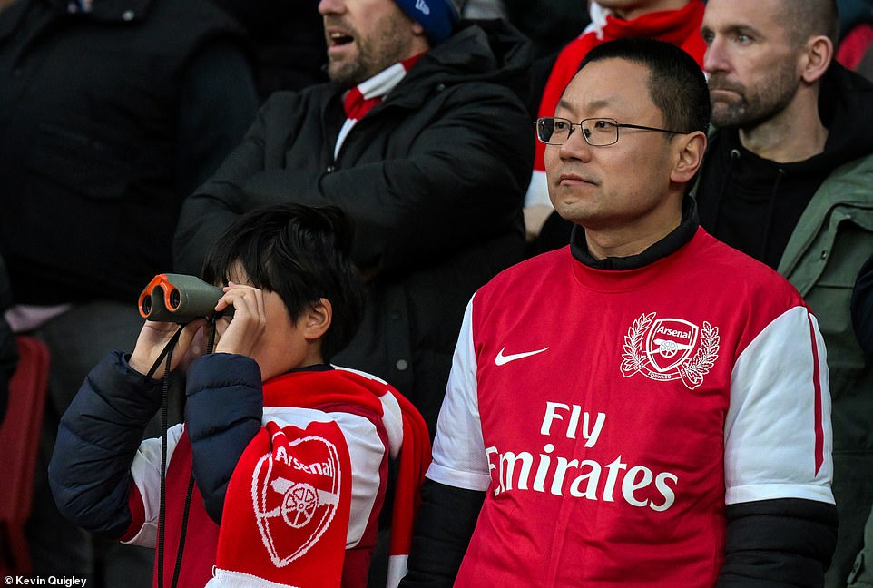 One supporter brought along a pair of binoculars to get a better look at the superstars entertaining the crowds on the pitch