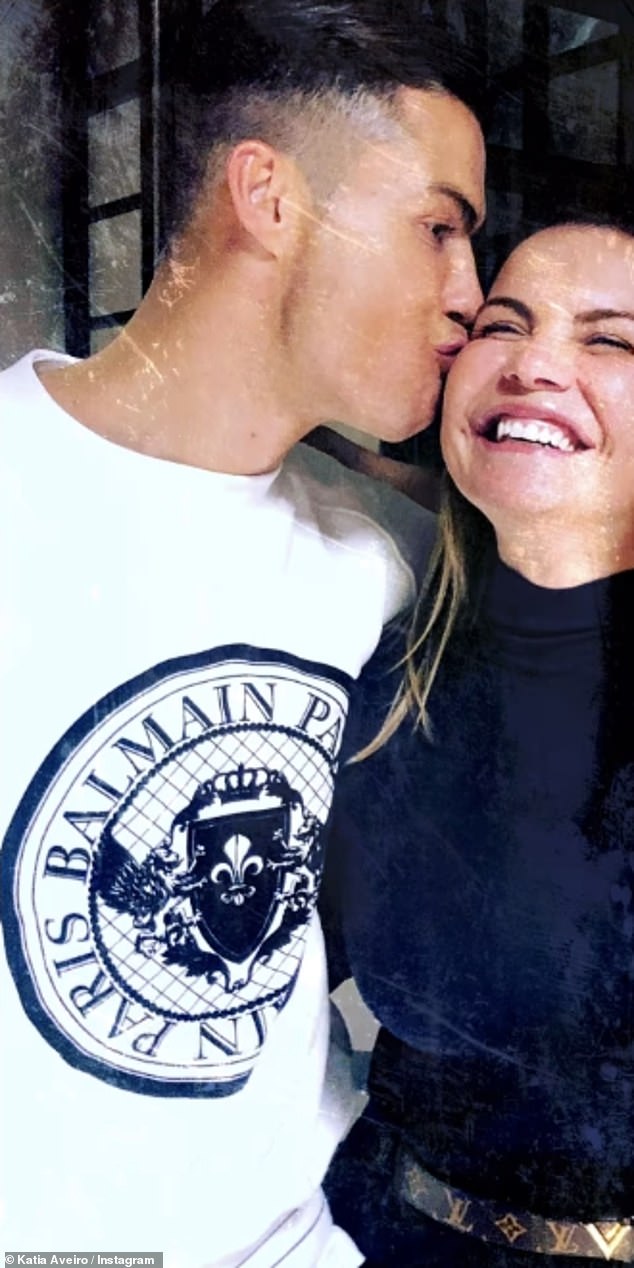 In another adorable photo, Ronaldo can be seen kissing his sister on the cheek and she beamed