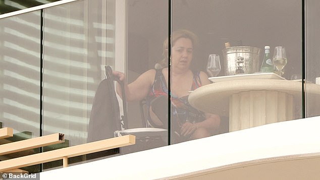 The former Queensland premier was seen with her foot on a chair in Burleigh Heads