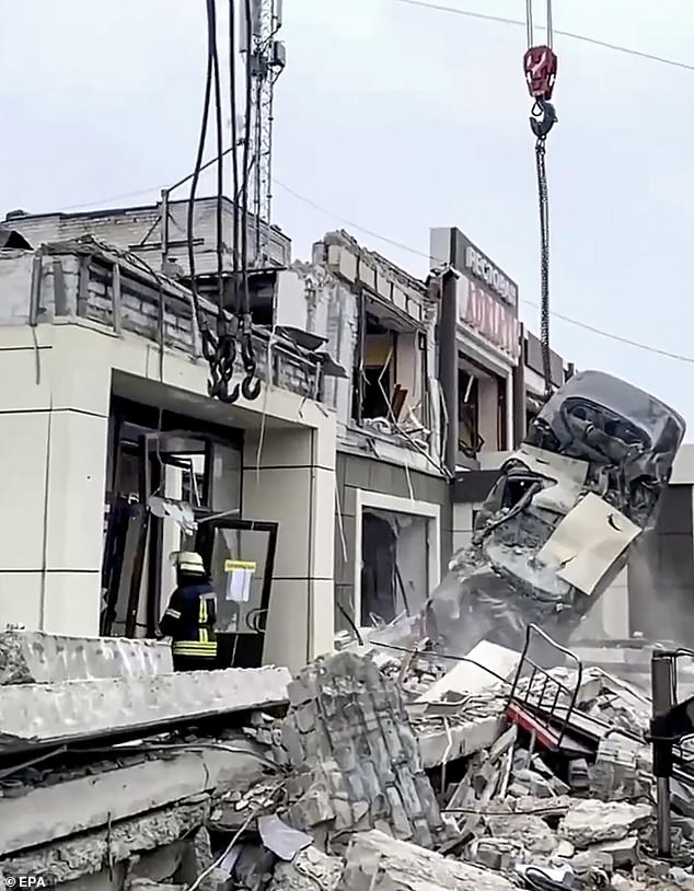 A still image from a Russian Emergency Situations Ministry outreach video shows a rescue worker amid the rubble of a bakery after a shelling in Lysychansk, Russian-controlled Ukraine, on February 3