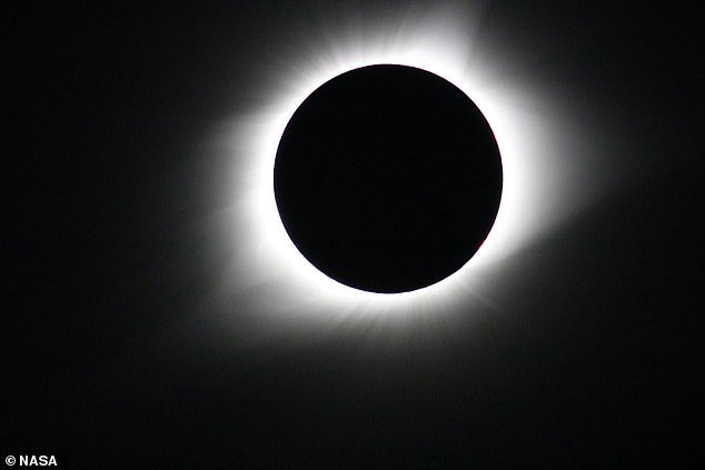 During a total solar eclipse, the moon nearly covers the sun, masking everything but the corona – the outermost layer that appears as a ring of light