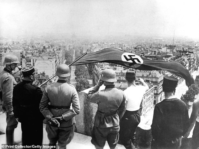 The Nazi flag flies from the Arc de Triomphe during the German occupation of France during World War II