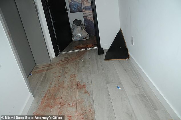 A trail of blood is seen on the floor of the luxury Miami home