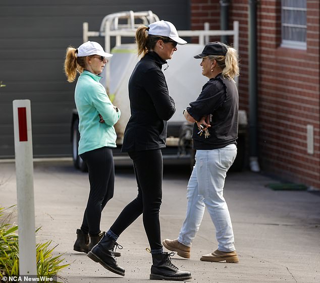 Women gathered outside the Buninyong police station as the massive search continued