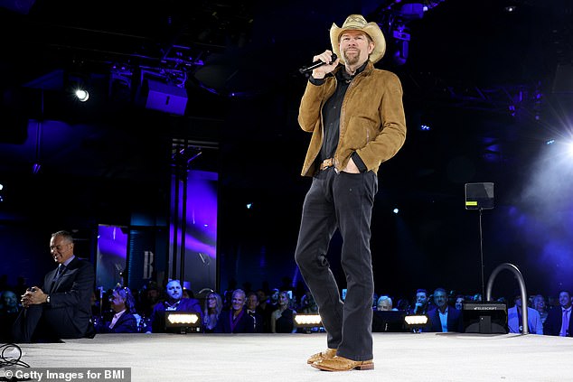 Keith performing on stage for the BMI Icon Award at the 2022 BMI Country Awards in Nashville in 2022