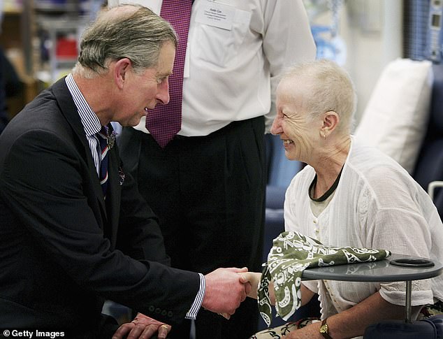 Charles, while Prince of Wales, talks to Maggie Sinclair at the Sydney Cancer Center at the Royal Prince Alfred Hospital, March 4, 2005