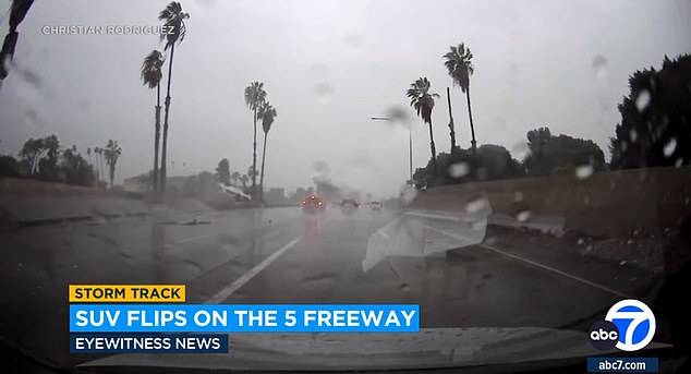 Video shows a white SUV driving along the northbound highway near Whittier Boulevard on Sunday around 4 p.m