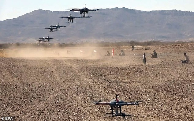 Houthis operate drones during a military exercise in a remote area on the outskirts of Sana'a, Yemen, February 3, 2024