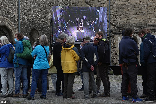 Hundreds of spectators – who reportedly book tickets for the concert years in advance – gathered around the mechanical organ as volunteers added a new pipe to the instrument to create a different sound (visitors pictured at the 2020 chord change)