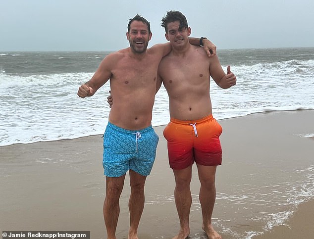 Jamie flashed a big smile as he posed with his son in his board shorts after the icy dip