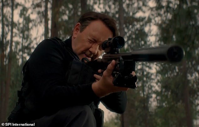 The House of Cards star is brandishing a sniper rifle for the action-packed role