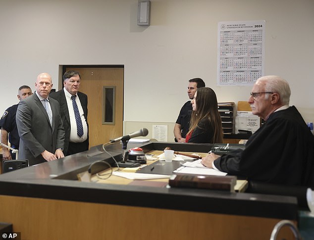 He appeared before Judge Timothy Mazzei, wearing a black suit and white shirt, for an update on the progress of his case