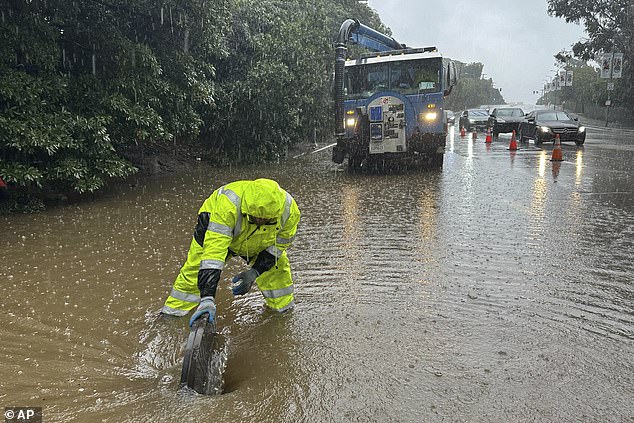 While AR families contribute to much of California's water supply, they also cause extreme flooding and damage (Photo: A vortex forms around a city worker in Los Angeles' Holmby Hills neighborhood on Monday)