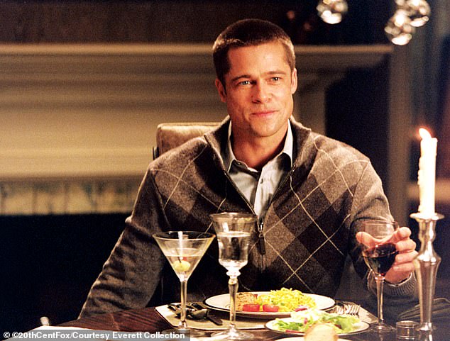 Pitt in Mr.  And Mrs.  Smith (2005) with a full meal and a glass of wine in front of him