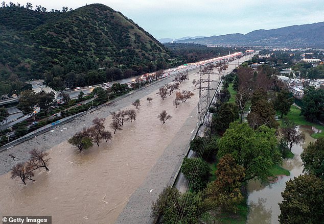 California is being hit by a deadly weather system that has dropped more than 14 inches of rain in some areas, such as Los Angeles (pictured)