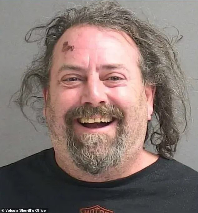 Brzuszkiewicz is seen smiling in his mugshot photo with a red gash on his forehead.  He was charged with failure to pay vehicle entrance fees and taken to the Volusia County Branch Jail, where he is being held on a $200 bond.