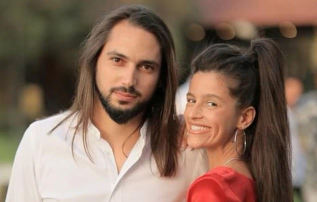 Ben Shimoni, 31, risked his own life to drive back to the massacre to save them (pictured with girlfriend Jessica)