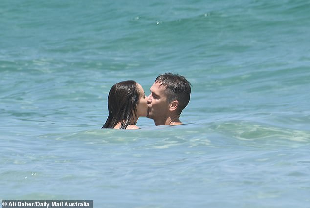 At some point their tongues met as they braved a storm while floating in the cool, refreshing water