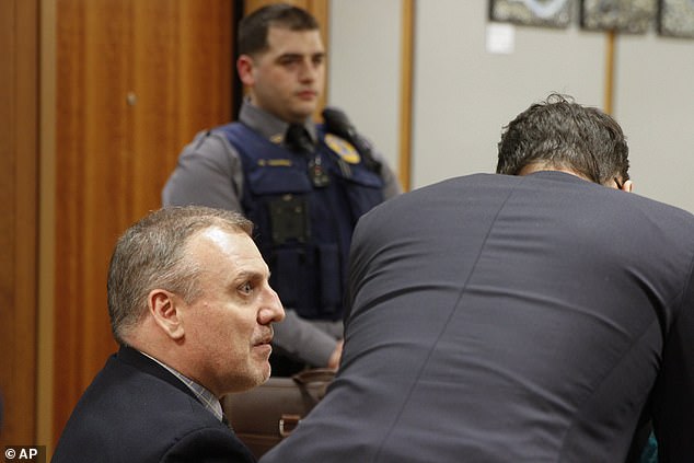 Brian Steven Smith confers with his attorneys during the opening day of his double murder trial on Tuesday, February 6, 2024 in Anchorage, Alaska