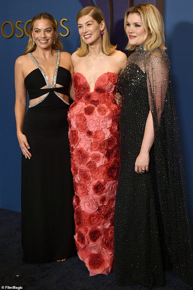 Margot has produced films including Saltburn, with whose director Emerald Fennell (right) and actress Rosamund Pike (centre) she is pictured at the Governors Awards on Tuesday.