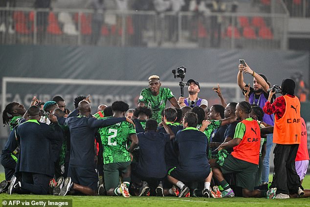 The team took a group photo at full-time as their despair from earlier in the match turned to joy