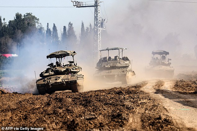 Israeli Army main battle tanks roll in southern Israel along the border with the Gaza Strip on February 7, 2024, amid ongoing fighting between Israel and the Palestinian militant group Hamas