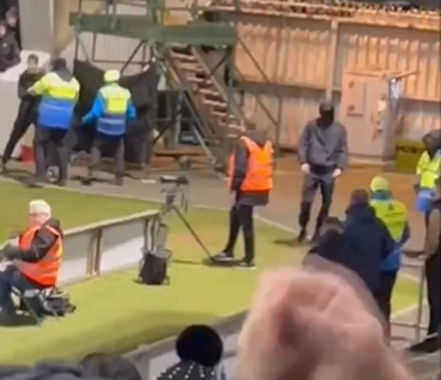 The supporter turned it into four stewards and approached the away fans, who allegedly stole a home flag